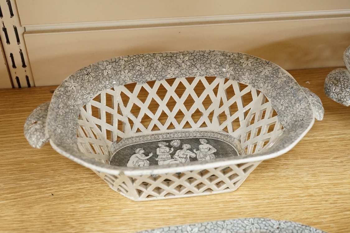 A pair of early 19th century pearlware transfer decorated figural two handled chestnut baskets and stands, attributed to Herculanuem, baskets 27cm wide including handles.